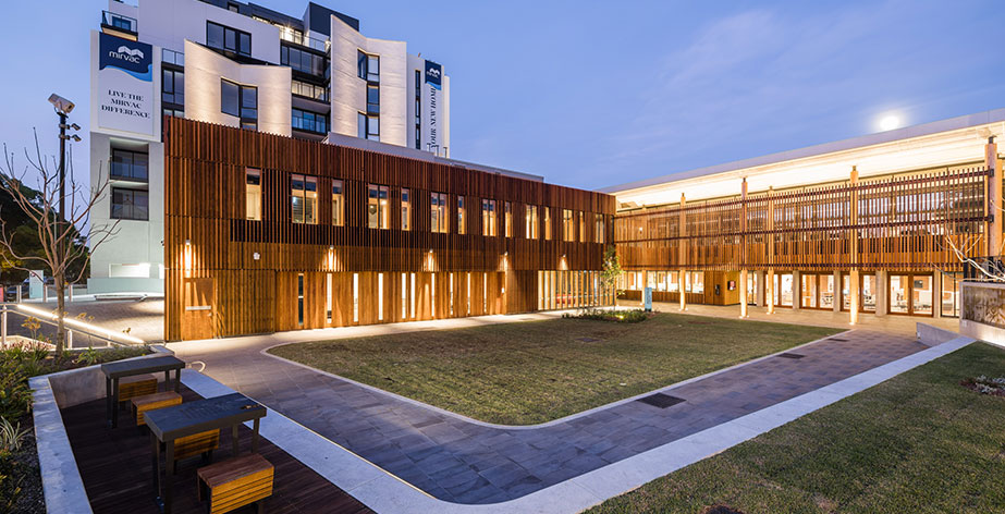 Marrickville Library and grass area external view at dusk