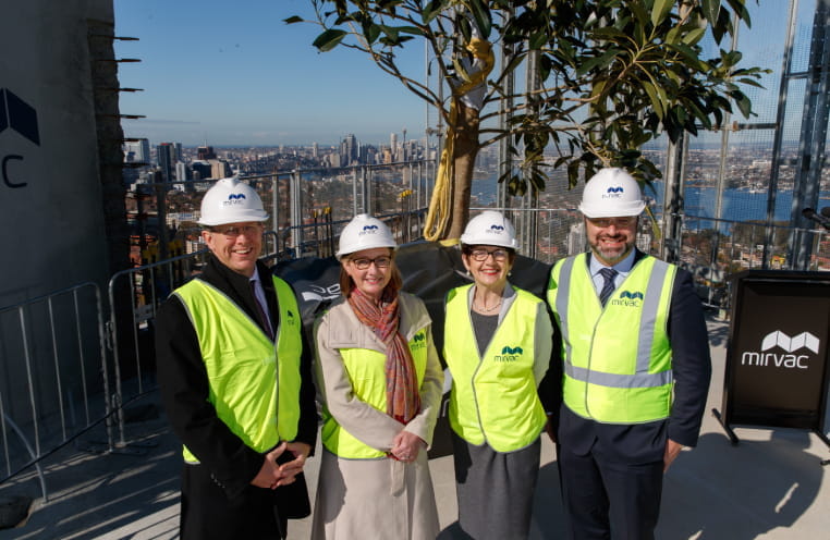 4 people in construction gear at St Leonards Square by Mirvac topping off