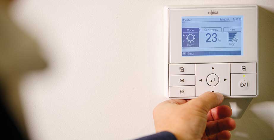 Person pressing button on smart home screen at House with No Bills