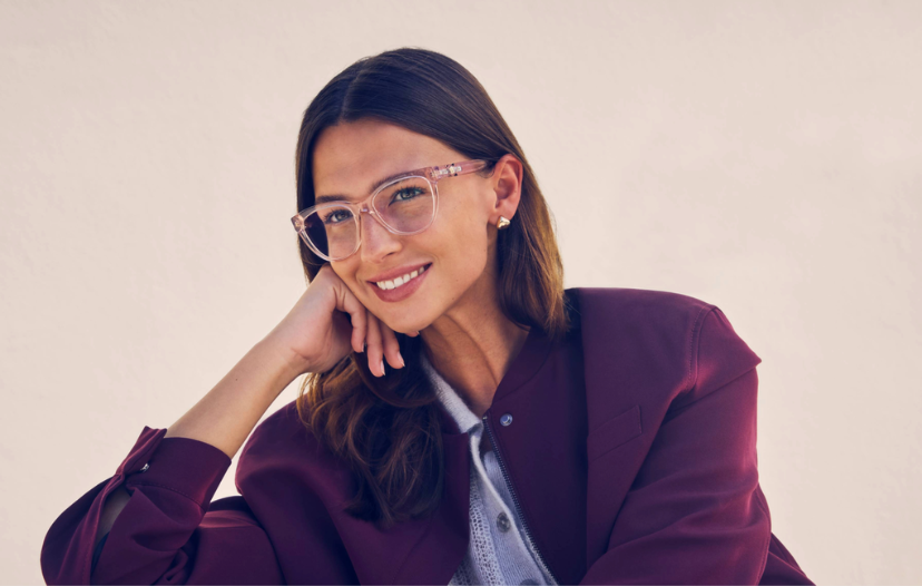 OPSM 25% Off lenes and extra - female wearing red glasses. 