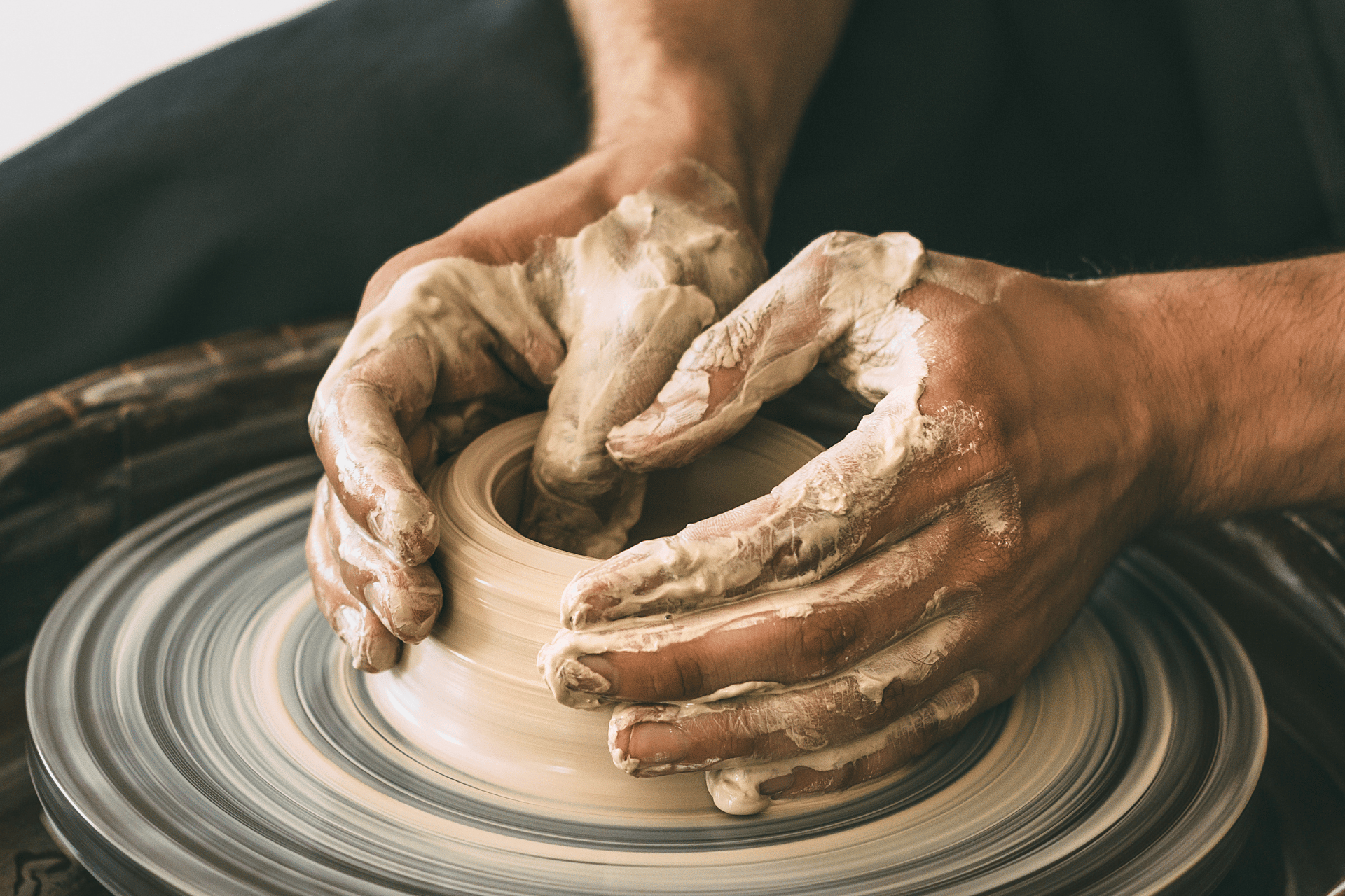 Hands moulding pottery